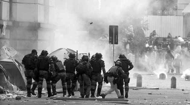 Police officers clash with demonstrators outside the Municipal Chamber during the teacher's strike in Rio de Janeiro